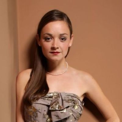 Anna Mae Routledge is posing for a photo shoot. 